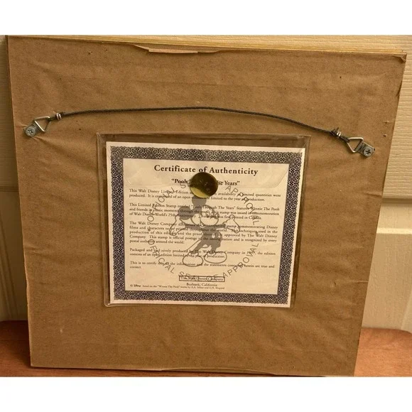 POOH THROUGH THE YEARS COMMEMORATION OF DISNEY WORLDS 25TH ANNIVERSARY COA FRAME